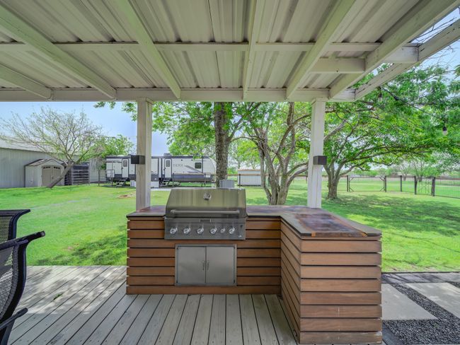 Deck with an outdoor kitchen, house two. | Image 28