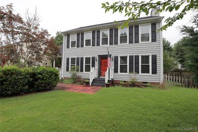 Colonial house with a front lawn | Image 1