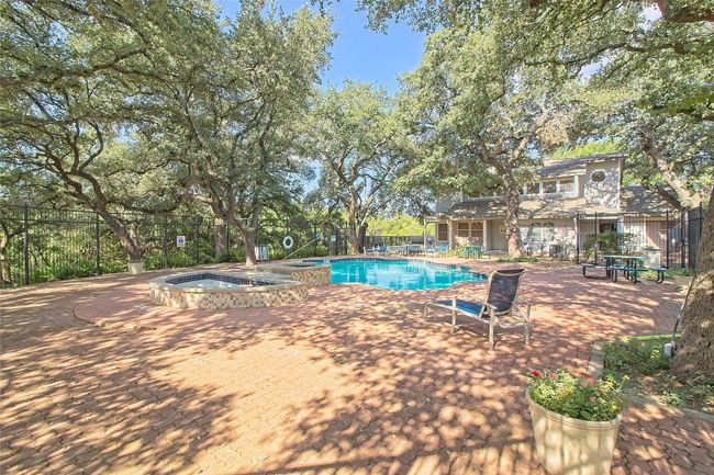 Community pool featuring a community hot tub and a patio area | Image 8