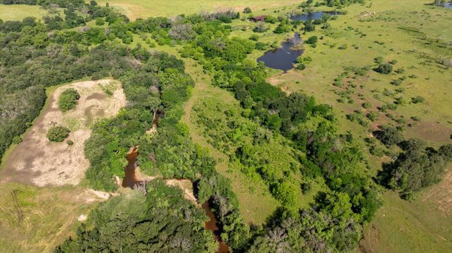 Aerial view of Kickapoo Creek and the back property line. | Image 21