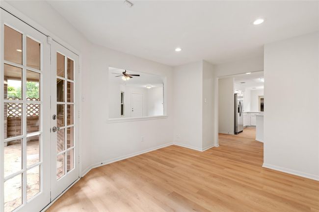 View from dining into kitchen highlights good layout and visual connection between spaces. | Image 9