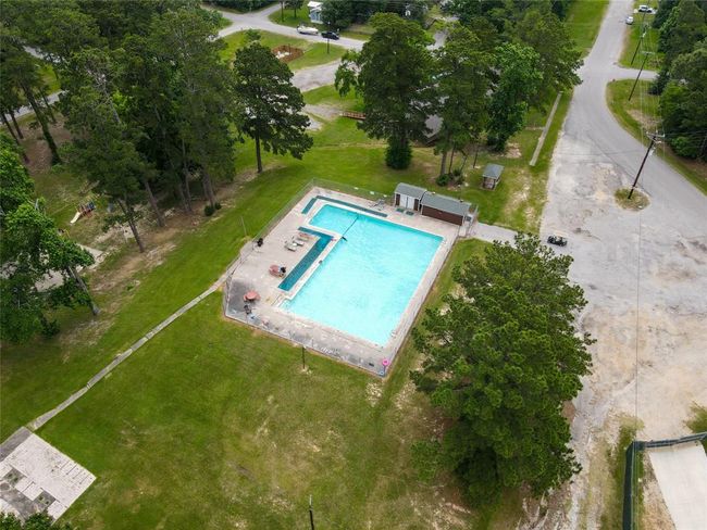 Aerial view of the community pool with playground middle left then one of two boat ramps beyond. | Image 44