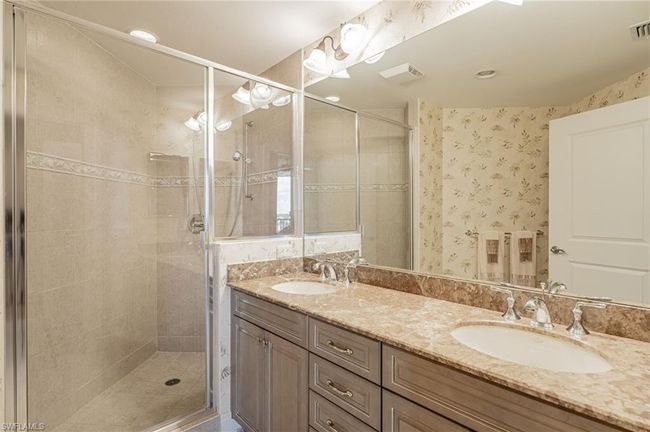 Bathroom featuring walk in shower and dual vanity | Image 33