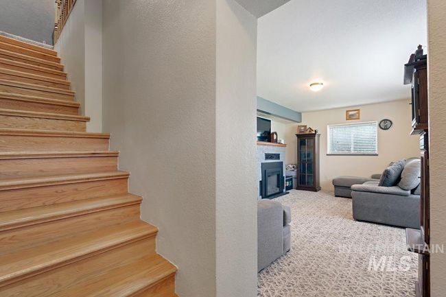 Stairway with a fireplace and carpet flooring | Image 20