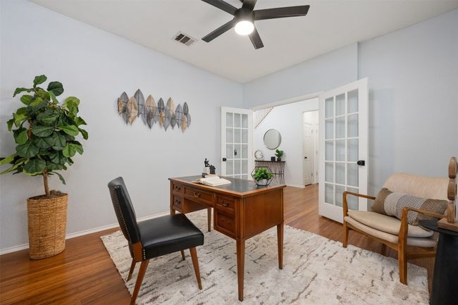 Home office featuring french doors, visible vents, a ceiling fan, and wood finished floors | Image 18