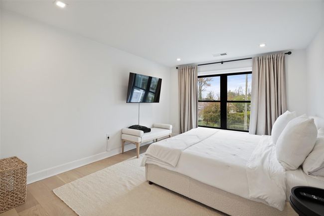 Bedroom featuring baseboards, wood finished floors | Image 26