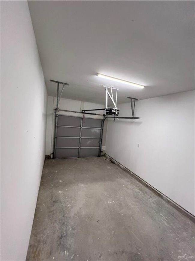 Garage featuring a garage door opener | Image 10