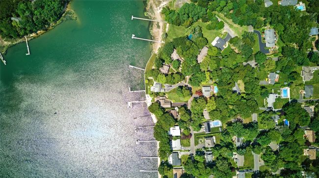 Aerial view of property and surrounding area with a nearby body of water | Image 15