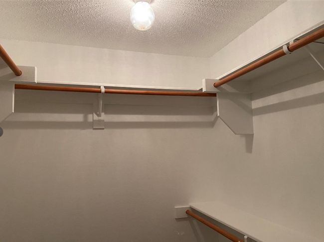 View of spacious closet | Image 19