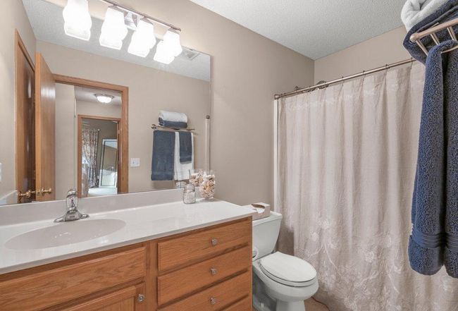 Upper level full bathroom in the hallway with comfort height vanity. | Image 15