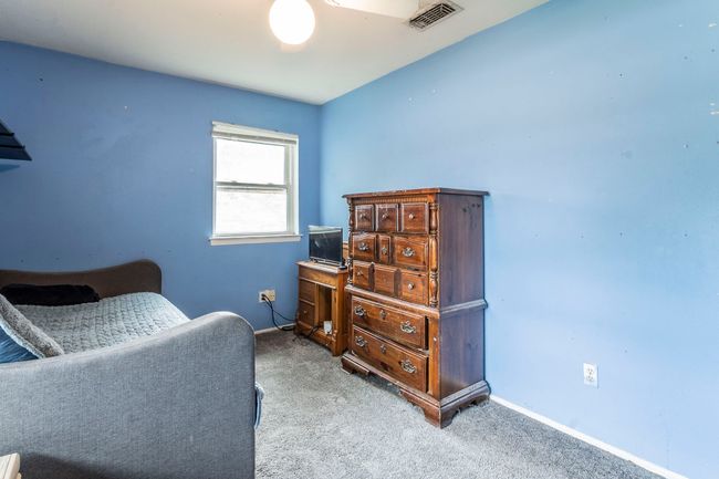 Bedroom with carpet and baseboards | Image 21