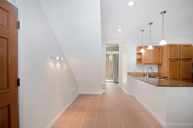 Entry showing a great use of space for storage or MUD area when you come in. | Image 15