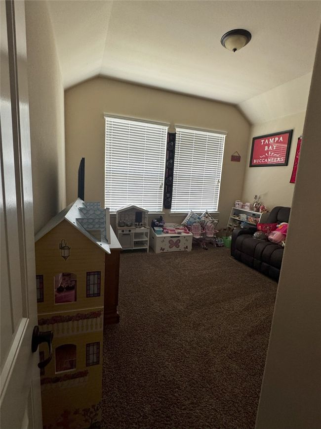 4th bedroom featuring vaulted ceiling and carpet flooring | Image 15