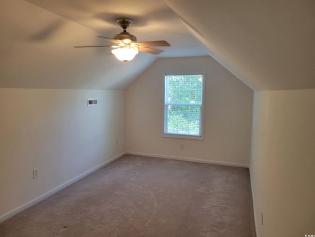 Bonus room featuring carpet, a ceiling fan, and lofted ceiling | Image 38