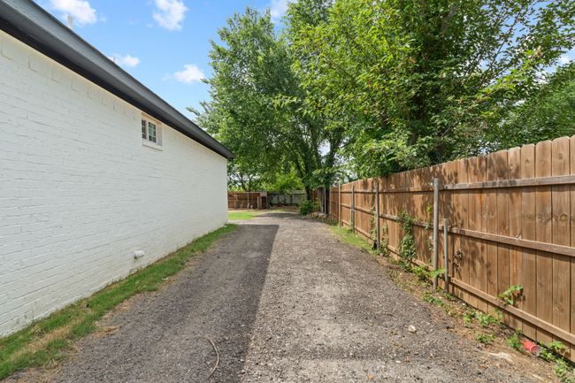 View of fenced backyard | Image 39