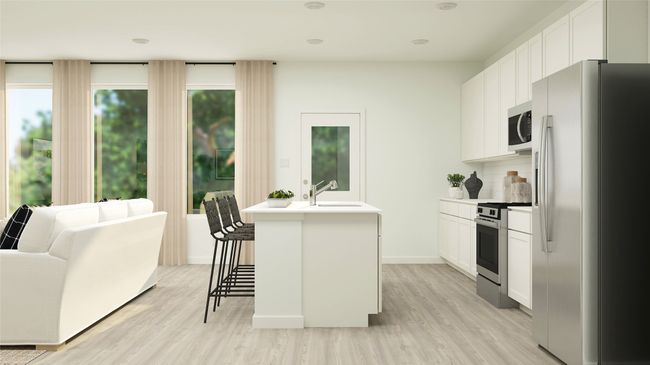 Kitchen featuring appliances with stainless steel finishes, light wood-style flooring, light countertops, and white cabinetry | Image 13