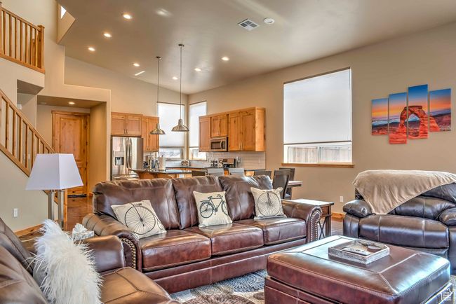 Living area with recessed lighting, stairs, and baseboards | Image 4