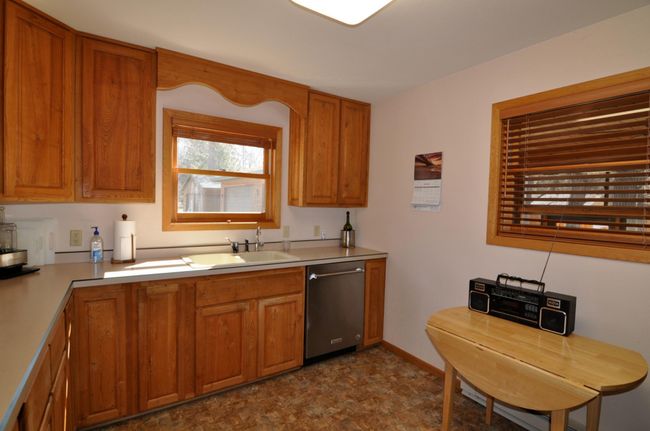 Cabinets go all the way to the ceiling to maximize storage. | Image 13