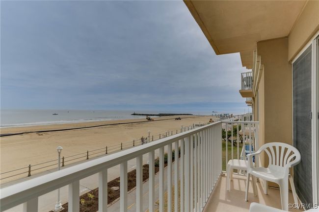 Balcony featuring a water view and a beach view | Image 9