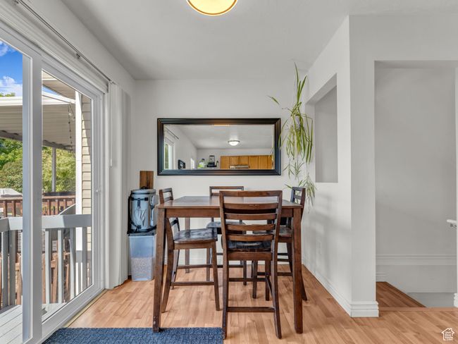 Dining space featuring wood finished floors | Image 13