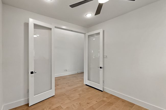 Spare room featuring a ceiling fan, light wood-style floors, and baseboards | Image 31