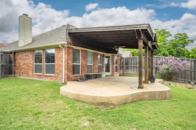 Back of property featuring ceiling fan, a patio area, brick siding, and a fenced backyard | Image 36