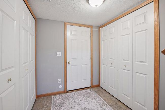 Large Foyer on the lower level with access to the Garage, Laundry Room, Utility Room, and Family Room. | Image 39