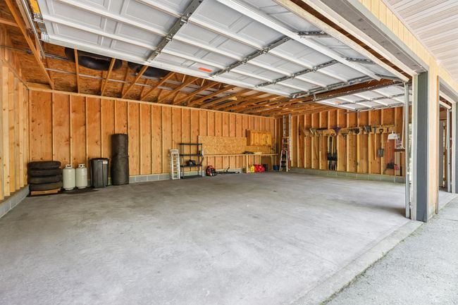 3 stall garage with 8 foot doors | Image 22