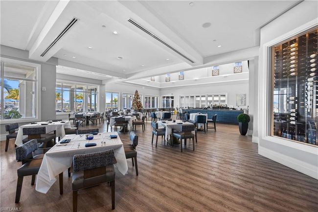 Dining room featuring baseboards, wood finished floors, beam ceiling, and recessed lighting | Image 35