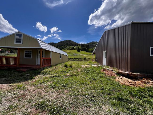 View of home's exterior with a deck with mountain view | Image 34