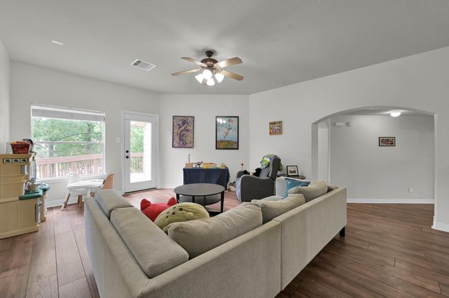 Enjoy this large upstairs game room with direct balcony access, offering beautiful views of the pool and golf course beyond. | Image 24
