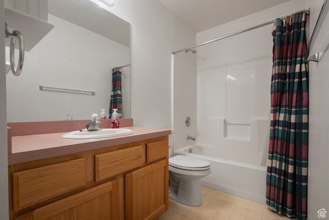Full bath featuring shower / bath combo and vanity | Image 17