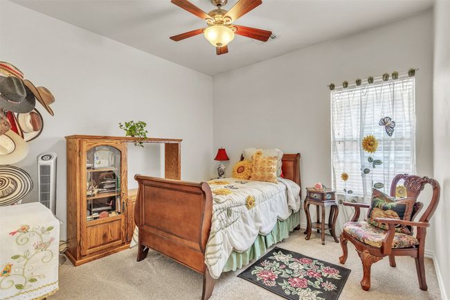 Bedroom with light carpet and ceiling fan | Image 21