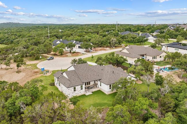 Aerial perspective of suburban area featuring a heavily wooded area | Image 31