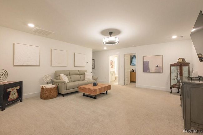 Living room featuring light carpet and recessed lighting | Image 35