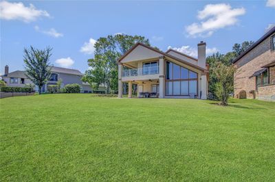 The perfect rolling lawn leading down to the boat docks and lake. | Image 1