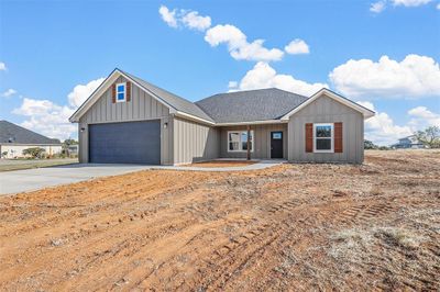 View of front of house featuring a garage | Image 2