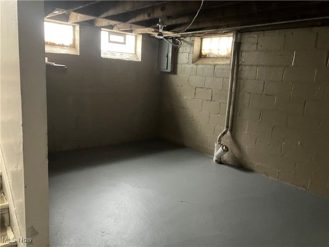 Below grade area featuring electric panel | Image 8
