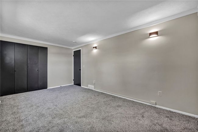 Unfurnished bedroom with carpet floors and ornamental molding | Image 14