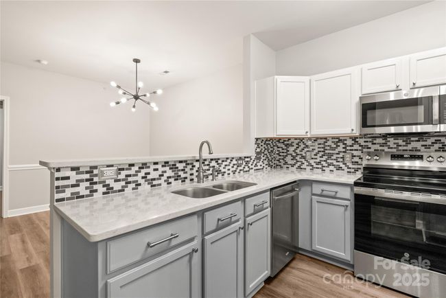 Upper counter is perfect for barstools. Convenient layout makes dinner prep easy | Image 10
