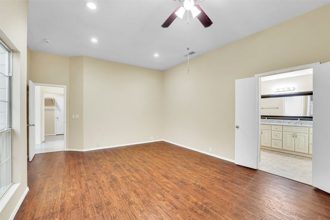 Unfurnished room with wood-type flooring and ceiling fan | Image 30