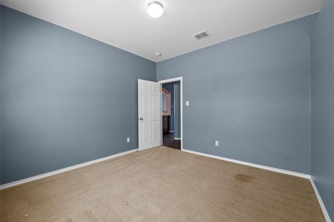 Carpeted empty room with baseboards and visible vents | Image 28