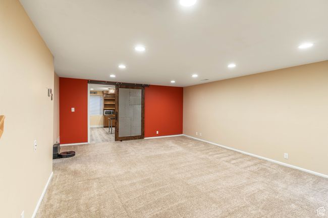 Unfurnished room featuring baseboards, light carpet, and recessed lighting | Image 29