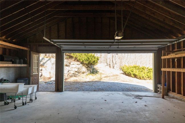 Garage featuring a garage door opener | Image 29