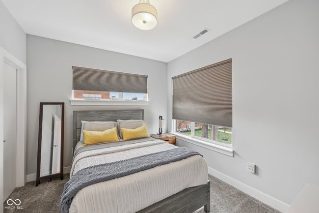 bedroom with carpet floors, baseboards, and visible vents | Image 19