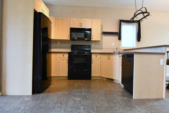 49 Prairie Ridge Close, Townhouse with 2 bedrooms, 2 bathrooms and 3 parking in Blackfalds AB | Image 9