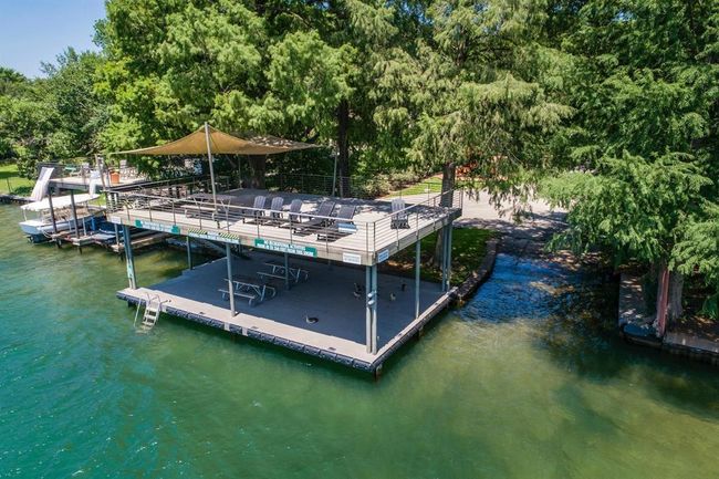 Dock area featuring a water view | Image 26