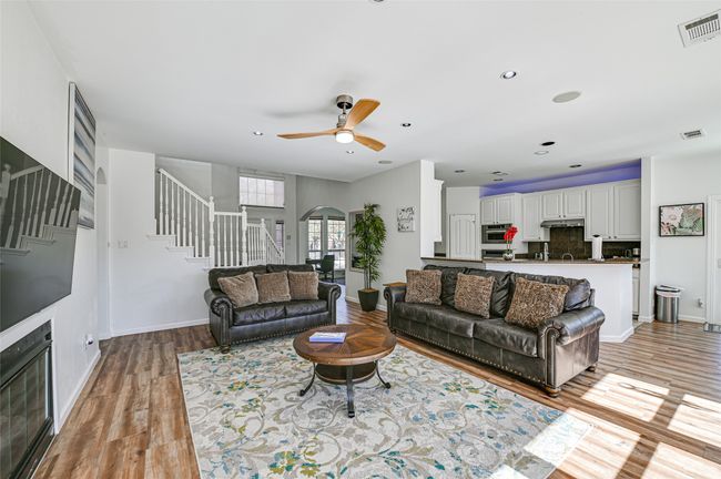 Living room with ceiling fan and light hardwood / wood-style floors | Image 23