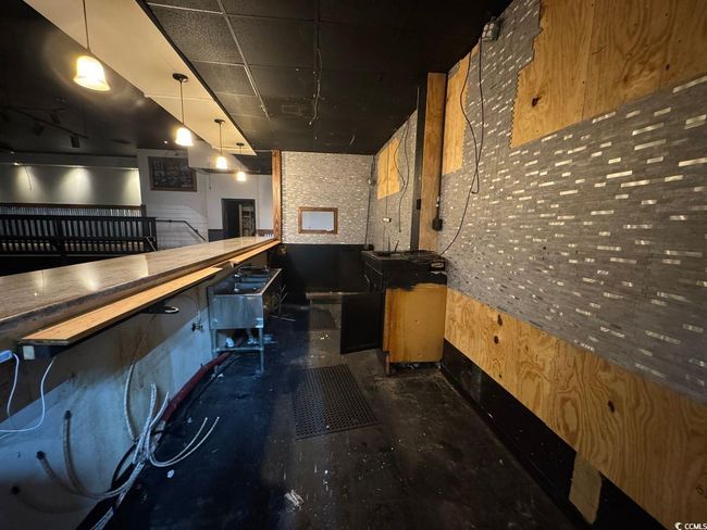 Bar area with concrete flooring | Image 7
