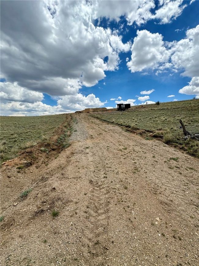View of dirt / gravel road featuring a rural view | Image 15